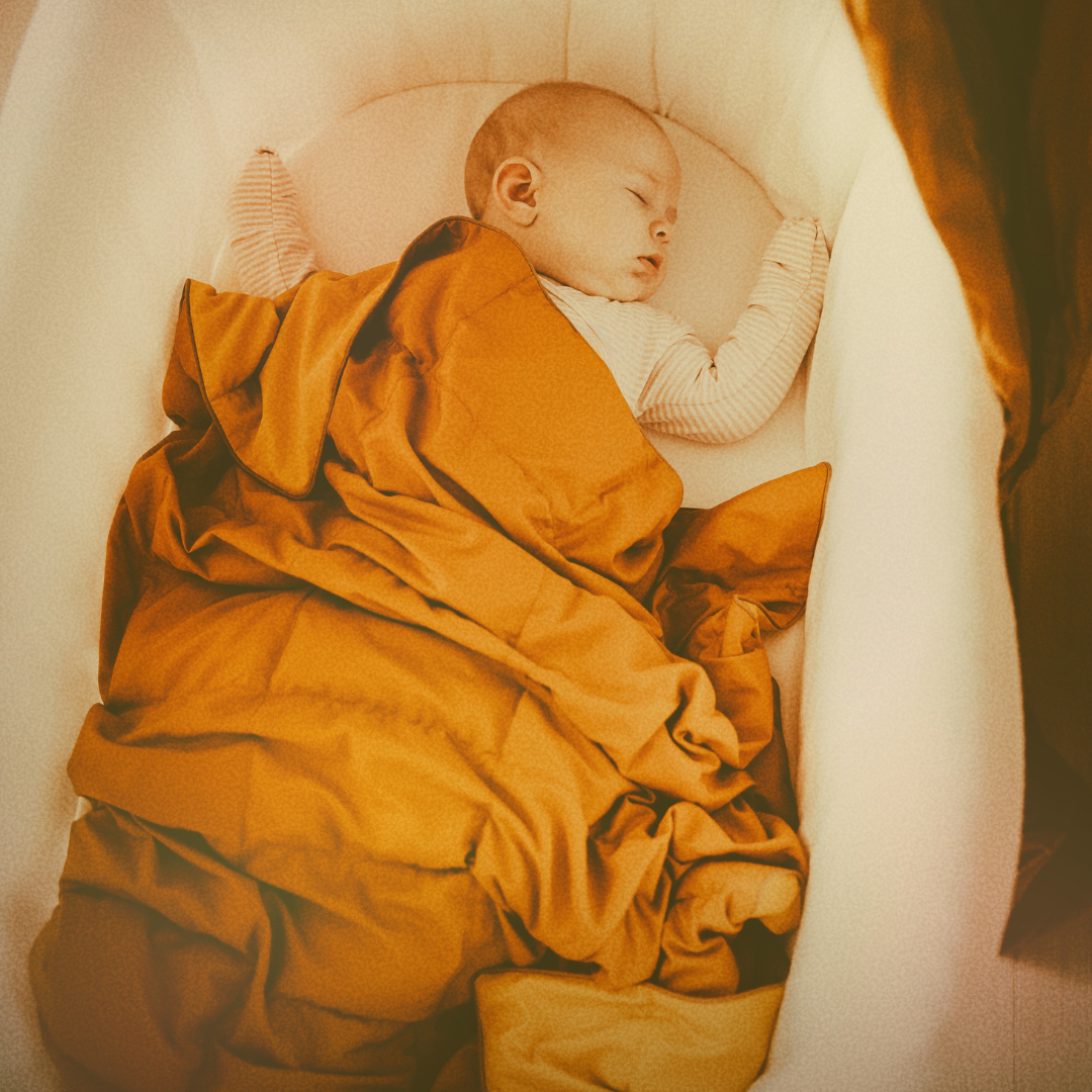 Baby with weighted blanket
